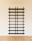 Modular media shelving unit with black shelves, black vertical posts, and two bays, shown with eight open shelf levels.