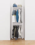 Closet storage system with white shelves and white vertical posts, plus hanger bars, shown with open shelving and one open shelf level.