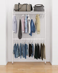 Closet storage system with white shelves and white vertical posts, plus hanger bars, shown with open shelving and one open shelf level.