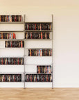 DVD media storage shelving unit with satin shelves and satin vertical posts, two bays, shown with open media storage shelf levels.