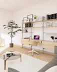 Desk shelving unit with black shelves and satin vertical posts, shown with desk surface and open shelf levels.