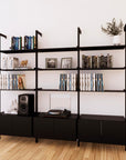 LP vinyl media storage shelving unit with black shelves and black vertical posts, three bays, shown with open record storage shelf levels.