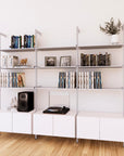 LP vinyl media storage shelving unit with white shelves and satin vertical posts, three bays, shown with open record storage shelf levels.