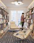 Aluminaire wood inspired modular shelving unit with wood-look aluminum shelves and white vertical posts, one bay, styled in a modern room.