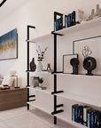 Wall-mounted aluminum shelving with books and decor in a modern living space.
