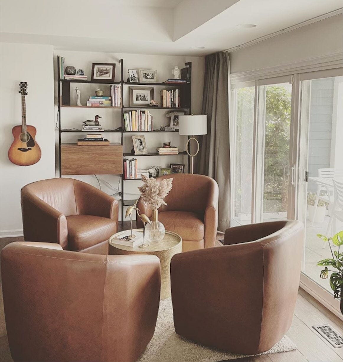 Elegant living space featuring Modern Shelving's PAL series shelving units full of decorative items and books, showcasing versatile and stylish storage solutions.