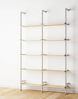 Wood shelf modular shelving unit with Casting Light shelves and white vertical posts, two bays, 24-inch shelf width, shown with open shelf levels.