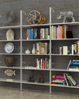 Modular shelving unit with black shelves and black vertical posts, three bays, shown with open shelf levels.