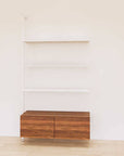 Retail display shelving unit with wood-tone SOI finish shelves, white vertical posts, and base cabinets in a 48-inch configuration, shown with open display shelving.