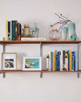 Aluminaire two-shelf modular shelving unit with wood-look aluminum shelves, satin vertical posts, one bay, 48-inch width, and two open shelf levels.
