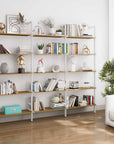 Aluminaire wood inspired modular shelving unit with wood-look aluminum shelves and white vertical posts, three bays, 31-inch shelf width, shown with open shelf levels.