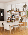 Floor-to-ceiling room divider shelving unit with lower storage cabinets with white shelves and white vertical posts, one bay, 24-inch bay width, six open shelf levels, floor-to-ceiling supports, styled in a room setting with books and decor.