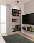 DVD media storage shelving unit with black shelves and satin vertical posts, one bay, 24-inch shelf width, styled in a modern room.