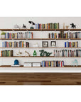 Modular shelving unit with Tea for Two shelves, black vertical posts, and one bay, shown with three open shelf levels styled in a room setting.