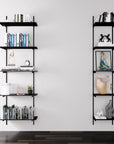 Modular shelving unit with black shelves, black vertical posts, and one bay, shown with three open shelf levels styled in a room setting.