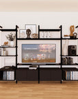 Harmony four-bay media unit with black shelves and black vertical posts, four bays, shown with open shelf levels.