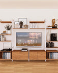 Harmony four-bay media unit with Tea for Two shelves and white vertical posts, four bays, shown with open shelf levels.