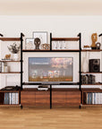 Harmony four-bay media unit with wood-look shelves and black vertical posts, four bays, shown with open shelf levels.