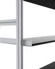Modular shelving unit with satin shelves and black vertical posts, shown in a close-up detail view.