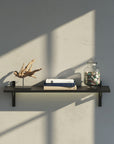 M-Float 12-inch-deep floating aluminum shelf with LED channel in black finish, shown as a single display shelf.