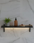 M-Float 12-inch-deep floating aluminum shelf with LED channel in black finish, shown as a single display shelf.