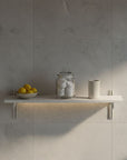 M-Float 12-inch-deep floating aluminum shelf with LED channel in satin finish, shown as a single display shelf.