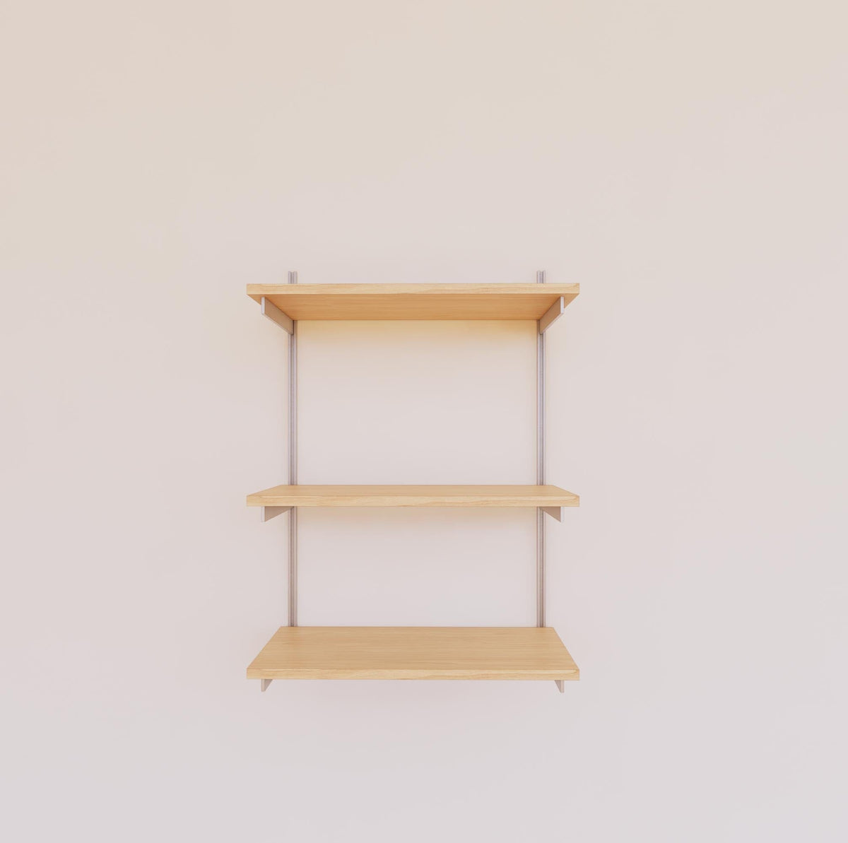 Modular shelving unit with Casting Light shelves, satin vertical posts, and one bay, shown with three open shelf levels.