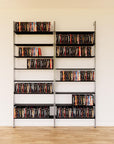 DVD media storage shelving extension with black shelves and satin vertical post, two bays, 31-inch shelf width, shown with open media storage shelf levels.