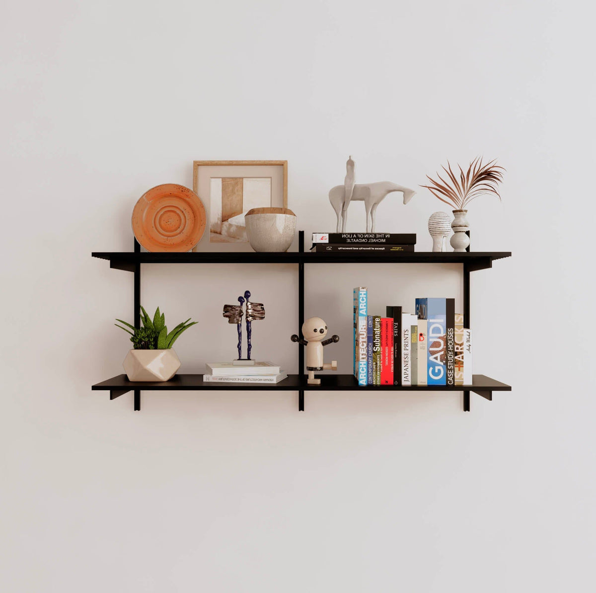 Modular shelving unit with black shelves, black vertical posts, and one bay, shown with two open shelf levels.