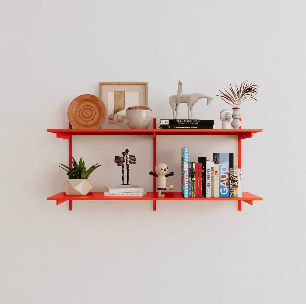 Modular shelving unit with orange shelves, orange vertical posts, and one bay, shown with two open shelf levels.