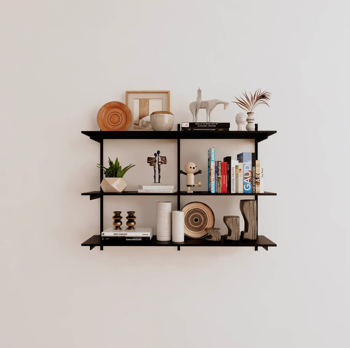 Modular shelving unit with black shelves, black vertical posts, and one bay, shown with three open shelf levels.