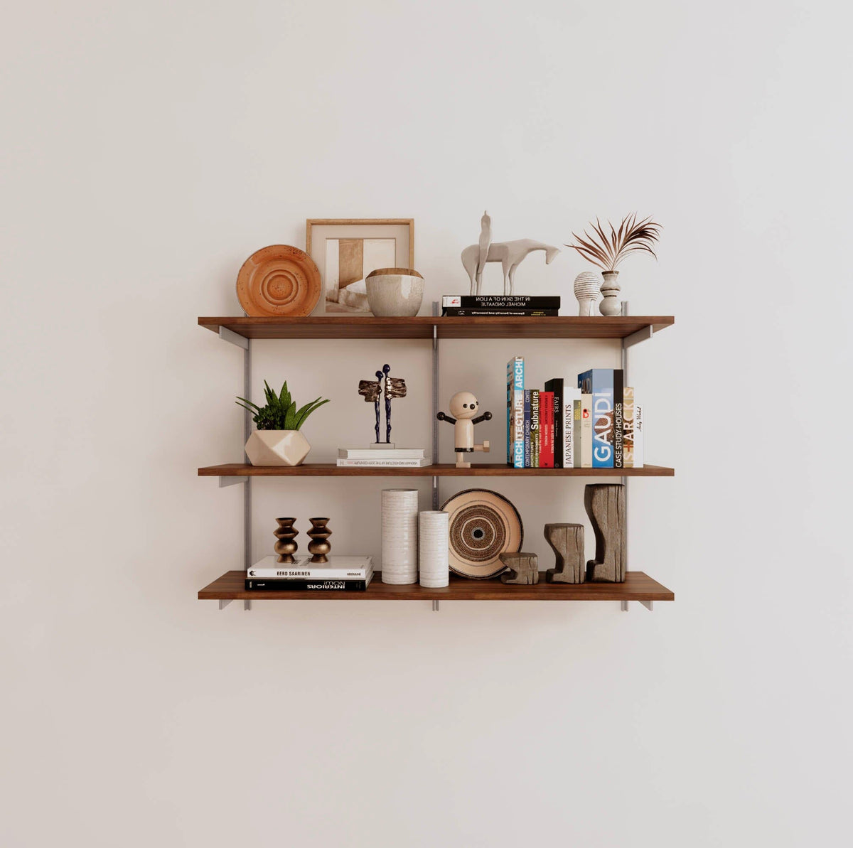 Modular shelving unit with Tea for Two shelves, satin vertical posts, and one bay, shown with three open shelf levels.