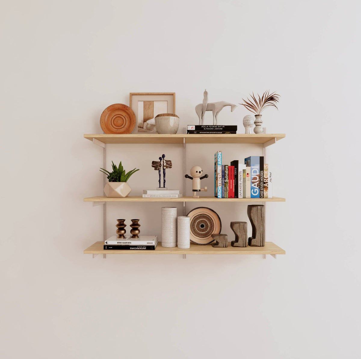 Modular shelving unit with Casting Light shelves, white vertical posts, and one bay, shown with three open shelf levels.