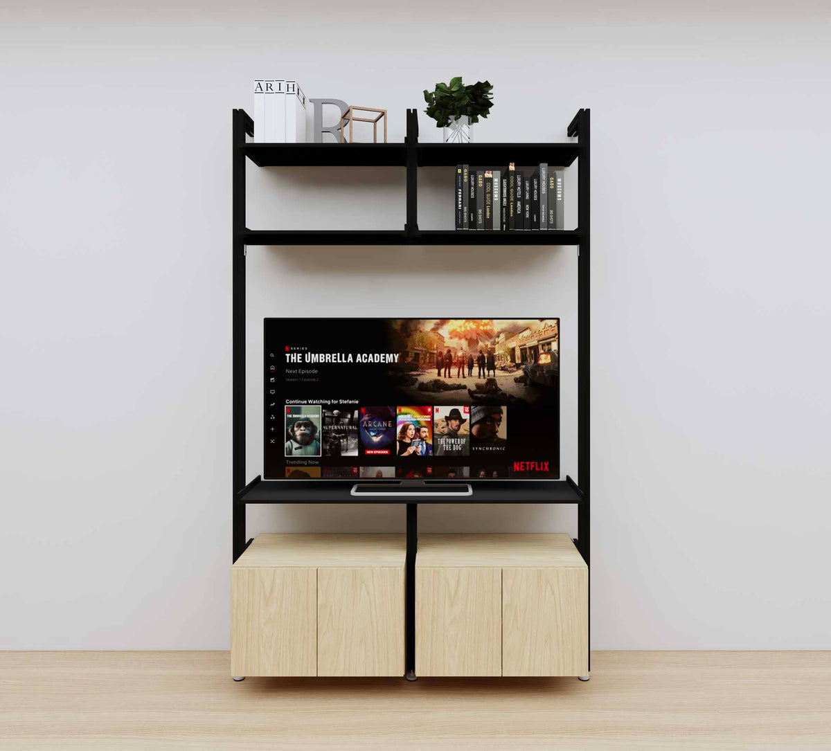 Modular media shelving unit with black shelves and black vertical posts, with Casting Light wood cabinet storage, two bays, shown with open shelf levels.