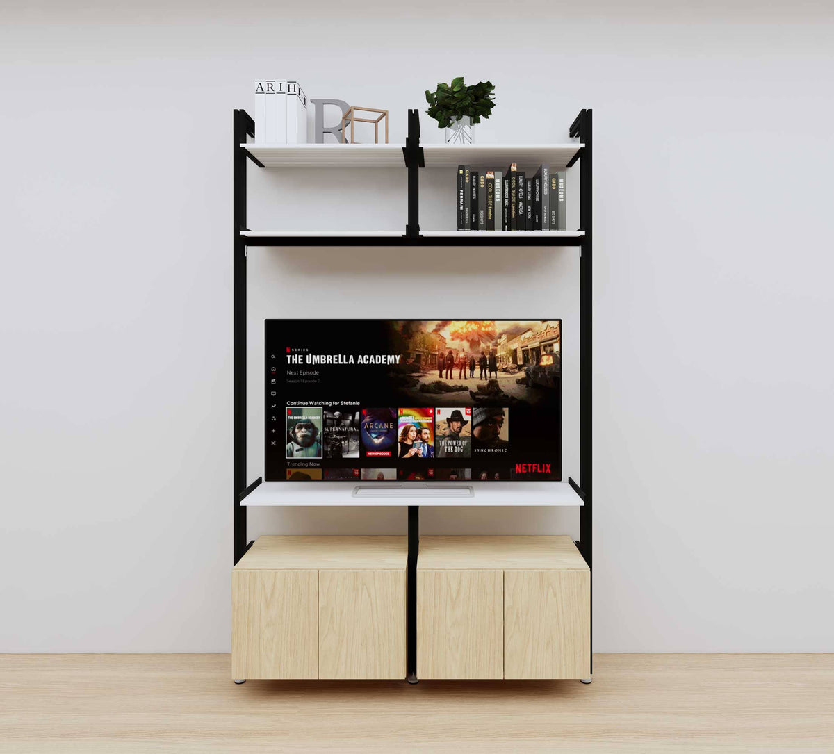 Modular media shelving unit with white shelves and black vertical posts, with Casting Light wood cabinet storage, two bays, shown with open shelf levels.