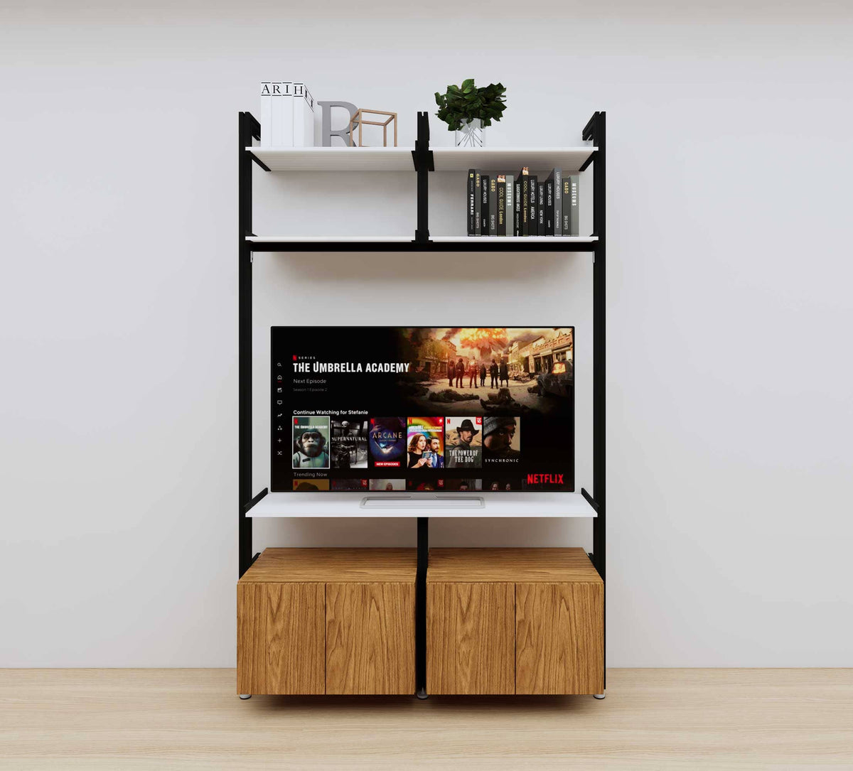 Modular media shelving unit with white shelves and black vertical posts, with Tea for Two wood cabinet storage, two bays, shown with open shelf levels.