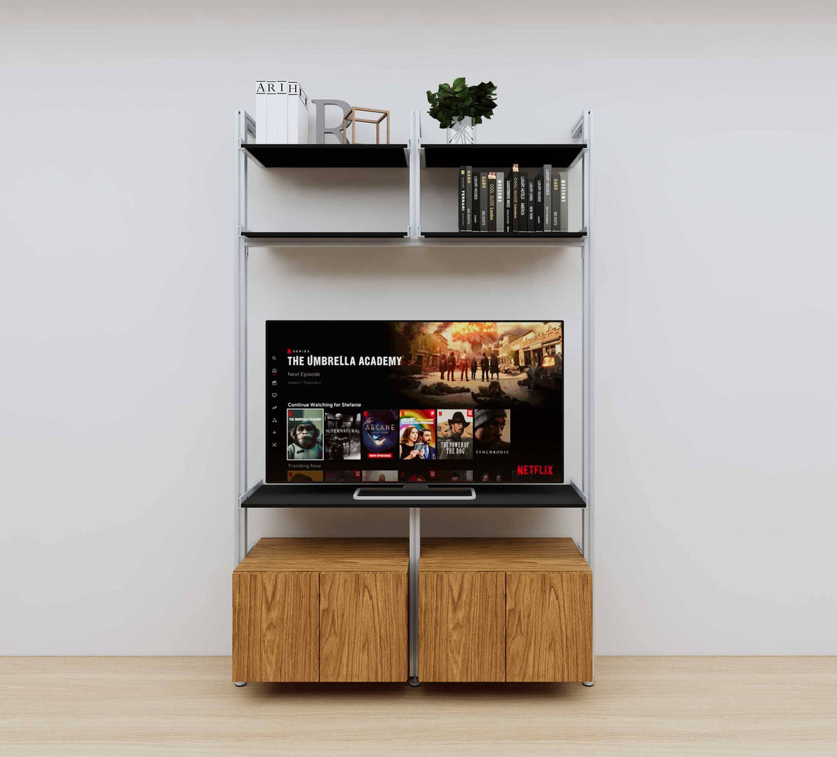 Modular media shelving unit with black shelves and satin vertical posts, with Tea for Two wood cabinet storage, two bays, shown with open shelf levels.