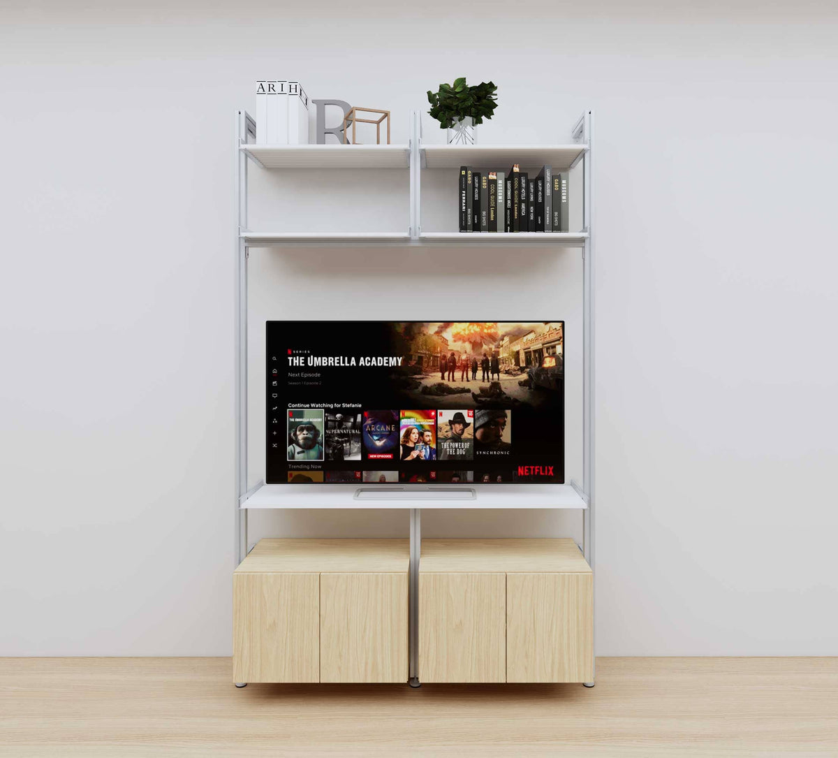 Modular media shelving unit with white shelves and satin vertical posts, with Casting Light wood cabinet storage, two bays, shown with open shelf levels.