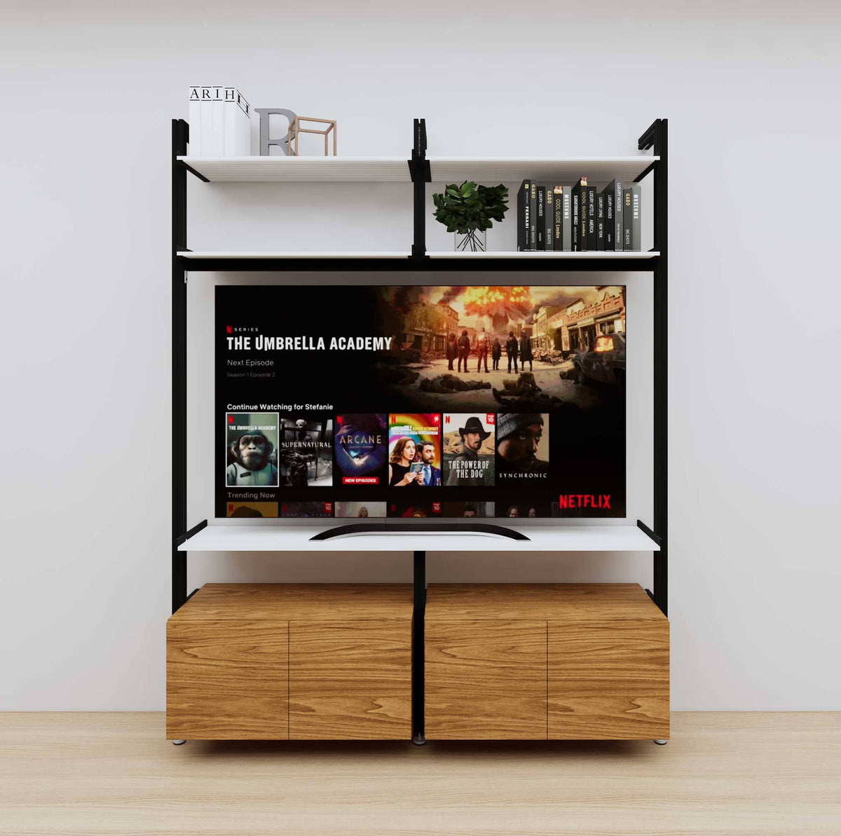 Modular media shelving unit with white shelves and black vertical posts, with Tea for Two wood cabinet storage, two bays, shown with open shelf levels.