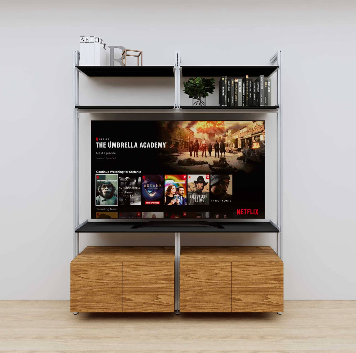 Modular media shelving unit with black shelves and satin vertical posts, with Tea for Two wood cabinet storage, two bays, shown with open shelf levels.