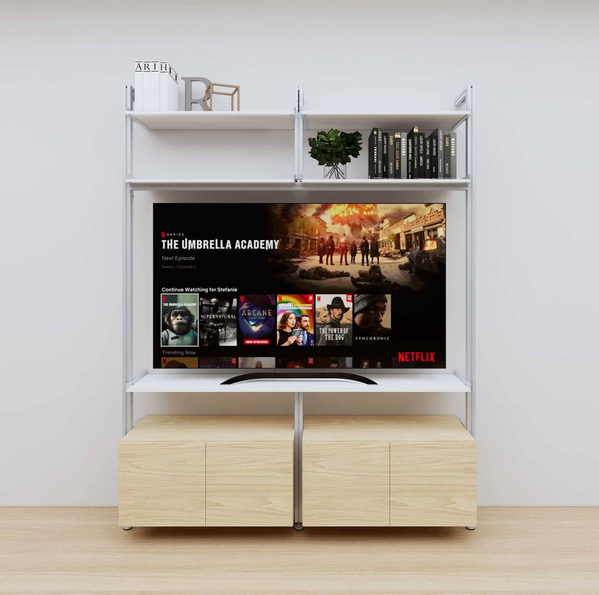 Modular media shelving unit with white shelves and satin vertical posts, with Casting Light wood cabinet storage, two bays, shown with open shelf levels.