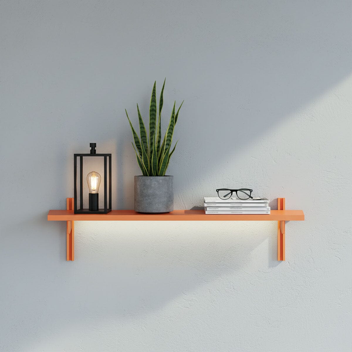 M-Float 6-inch-deep floating aluminum shelf with LED channel in orange finish, shown as a single display shelf.