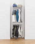 Closet storage system with satin shelves and satin vertical posts, plus hanger bars, shown with open shelving and one open shelf level.