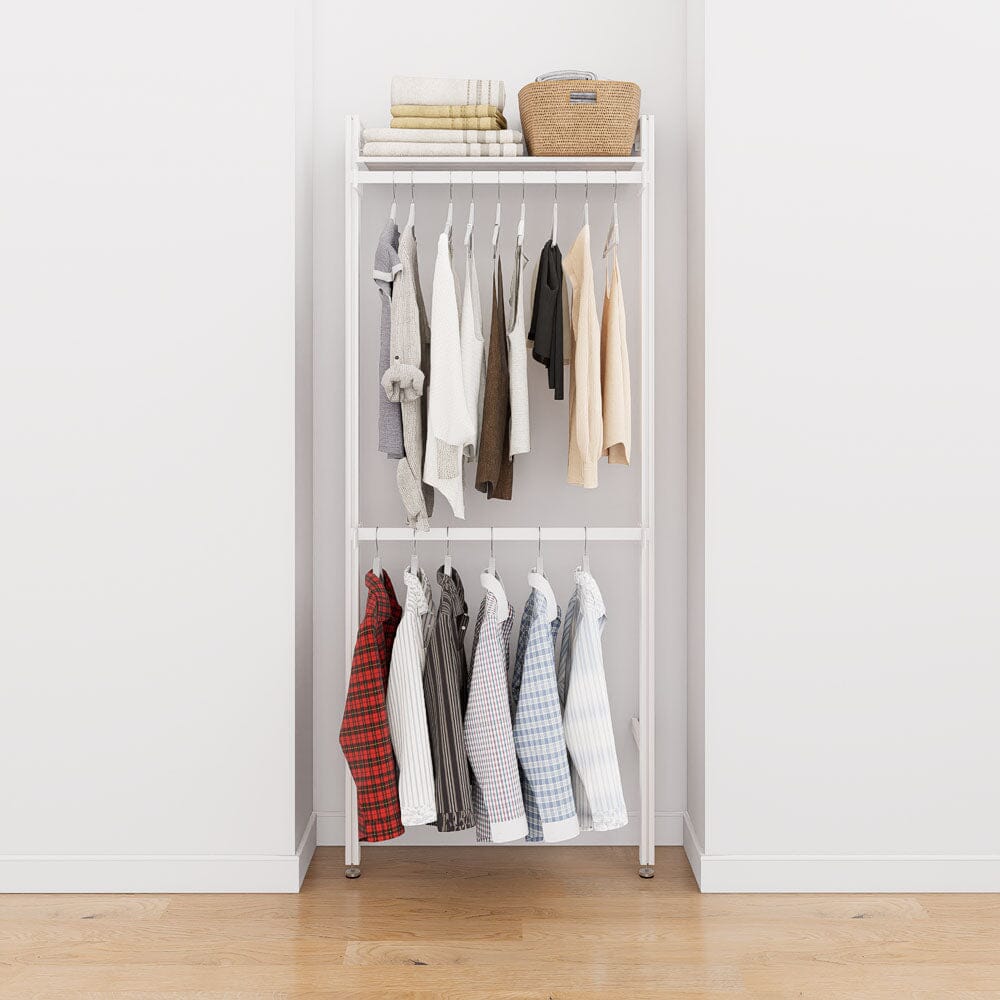 Closet storage system with white shelves and white vertical posts, plus hanger bars, shown with open shelving and one open shelf level.