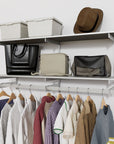 Modular shelving unit with storage with black shelves and black vertical posts.