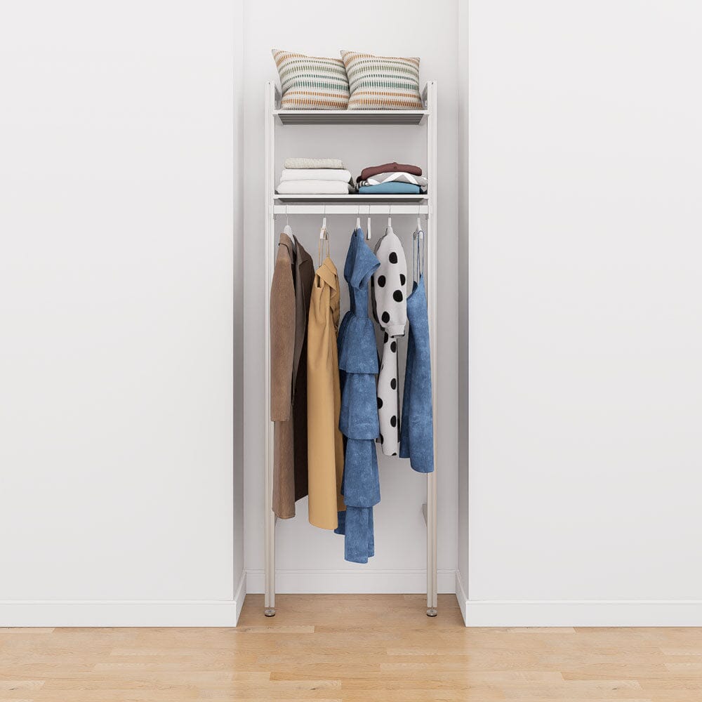 Modular shelving unit with storage with white shelves and white vertical posts.