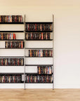 DVD media storage shelving unit with black shelves and satin vertical posts, two bays, 24-inch shelf width, shown with open media storage shelf levels.