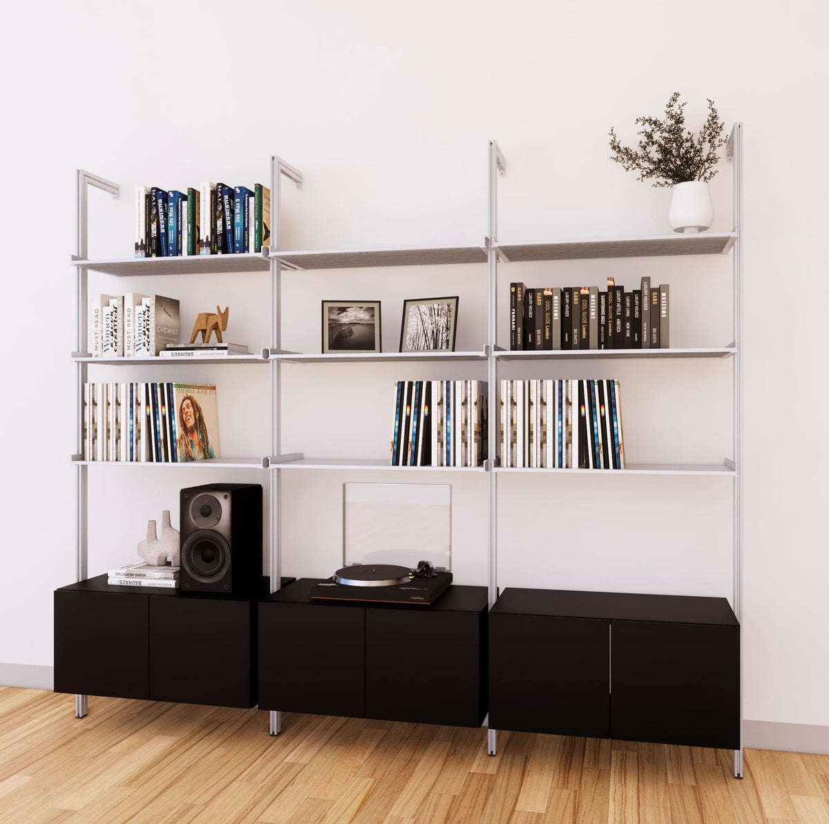 LP vinyl media storage shelving unit with black shelves and satin vertical posts, three bays, shown with open record storage shelf levels.