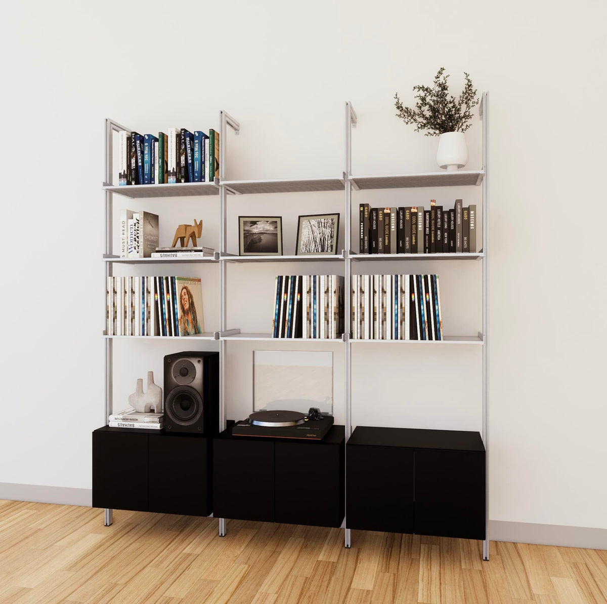 LP vinyl media storage shelving unit with black shelves and satin vertical posts, with Casting Light wood cabinet storage, three bays, shown with open record storage shelf levels.