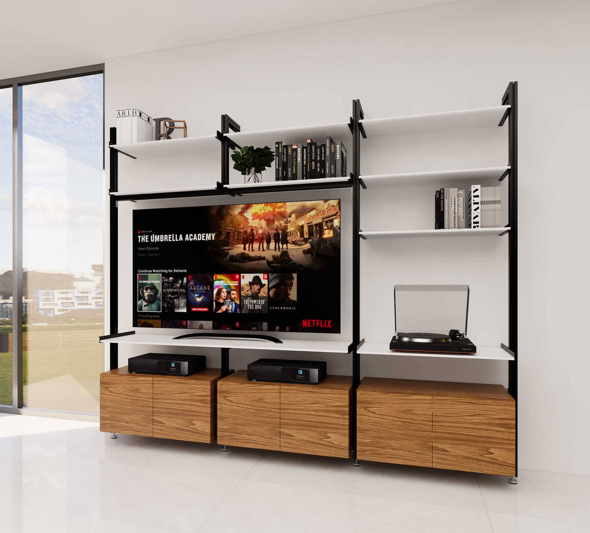 Media center shelving unit with three bays, plus Bw Tft finish, shown with open shelving.